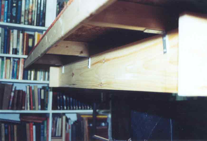 SUBJECT: baseboard underside, showing 'box cover' construction 

CAMERA:  Canon EOS Rebel-X SLR
MEDIA:  Kodak ISO 400 4-inch by 6-inch glossy print
FILE:  JPEG from HP 4100C scanner
EDITING:  Adobe Photoshop