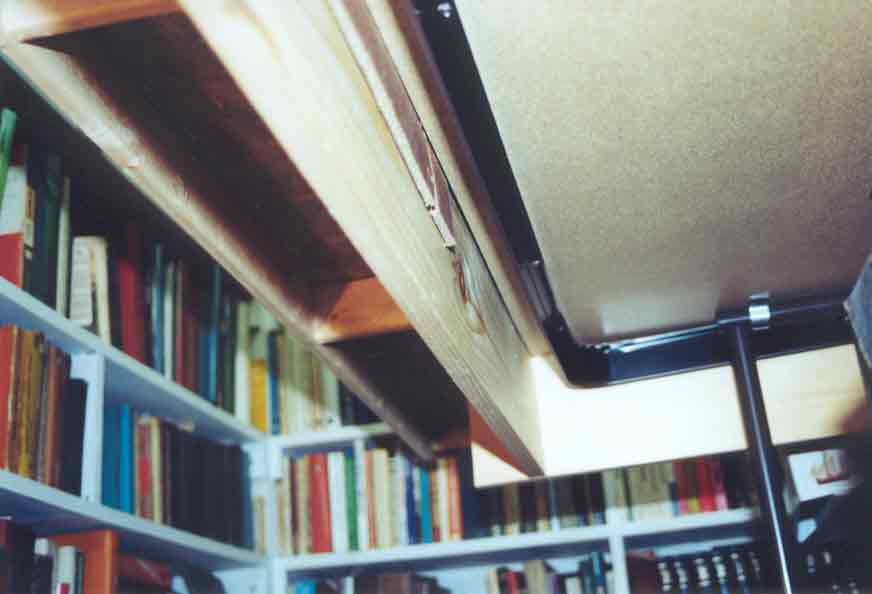 SUBJECT: baseboard underside, showing 'box cover' construction with shims 

CAMERA:  Canon EOS Rebel-X SLR
MEDIA:  Kodak ISO 400 4-inch by 6-inch glossy print
FILE:  JPEG from HP 4100C scanner
EDITING:  Adobe Photoshop