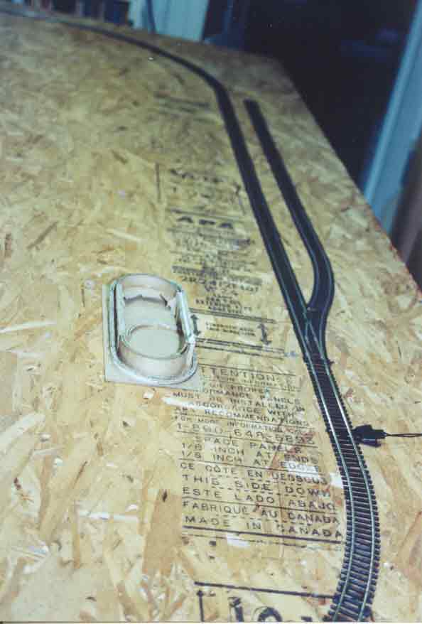 SUBJECT: Hornby track, trial fit on baseboard with 'Concept-2' first version 

CAMERA:  Canon EOS Rebel-X SLR
MEDIA:  Kodak ISO 400 4-inch by 6-inch glossy print
FILE:  JPEG from HP 4100C scanner
EDITING:  Adobe Photoshop