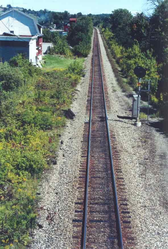 SUBJECT: Canadian Pacific Railway tracks, Cobleskill, New York, USA 

CAMERA:  Canon EOS Rebel-X SLR
MEDIA:  Kodak ISO 400 4-inch by 6-inch glossy print
FILE:  JPEG from HP 4100C scanner
EDITING:  Adobe Photoshop