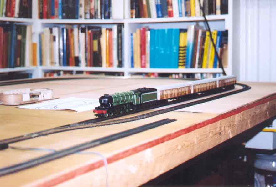 SUBJECT: Hornby Flying Scotsman testing track arrangement 

CAMERA:  Canon EOS Rebel-X SLR
MEDIA:  Kodak ISO 400 4-inch by 6-inch glossy print
FILE:  JPEG from HP 4100C scanner
EDITING:  Adobe Photoshop