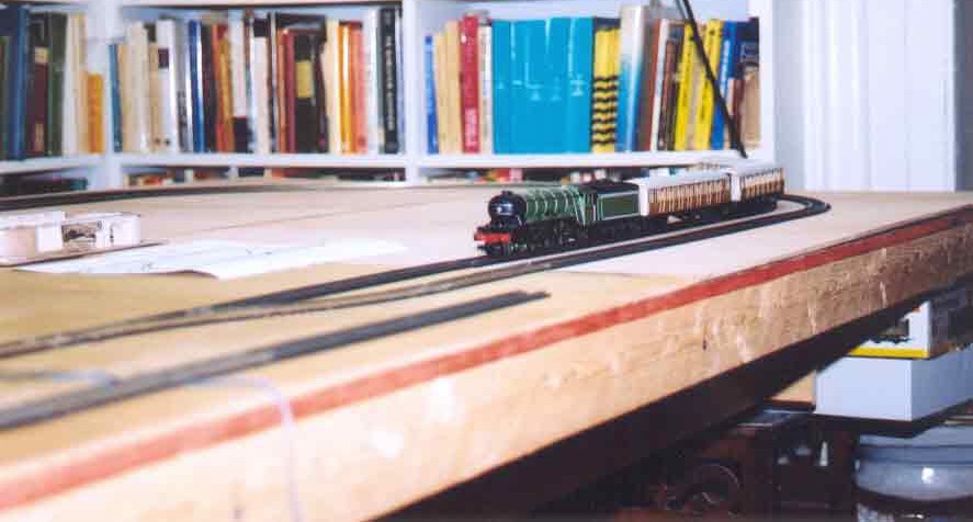 SUBJECT: Hornby Flying Scotsman testing track arrangement 

CAMERA:  Canon EOS Rebel-X SLR
MEDIA:  Kodak ISO 400 4-inch by 6-inch glossy print
FILE:  JPEG from HP 4100C scanner
EDITING:  Adobe Photoshop