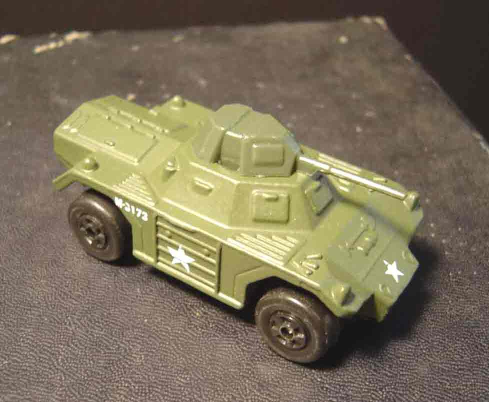 SUBJECT: 1/54 scale model Ferret armored car, non-flood illumination

CAMERA:  Sony DSC-P92 Cyber-shot
MEDIA:  Sony MSA-64A Memory Stick at 1.2 megapixel resolution
FILE:  JPEG from Sony Image Transfer version 1.00.1015.01
EDITING:  Adobe Photoshop