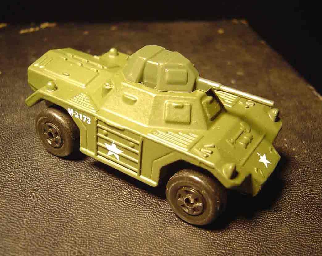 SUBJECT: 1/54 scale model Ferret armored car, floodlamp illumination

CAMERA:  Sony DSC-P92 Cyber-shot
MEDIA:  Sony MSA-64A Memory Stick at 1.2 megapixel resolution
FILE:  JPEG from Sony Image Transfer version 1.00.1015.01
EDITING:  Adobe Photoshop